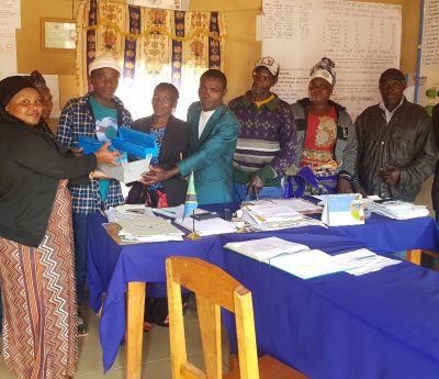 NPE, CMC, Care Giver, CCWs, VEO, WEO and OVC (Bruno Nyagawa). Handing over startup kit for OVC who gate chance of study Electricity course in Ikuna Ward